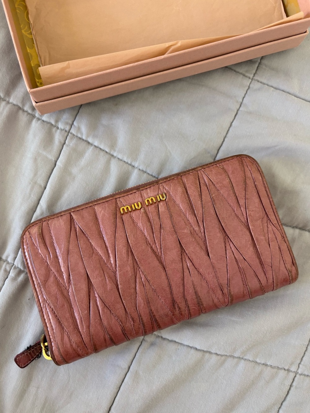 Miu Miu Matelassé leather long zip wallet in a quilted pink design